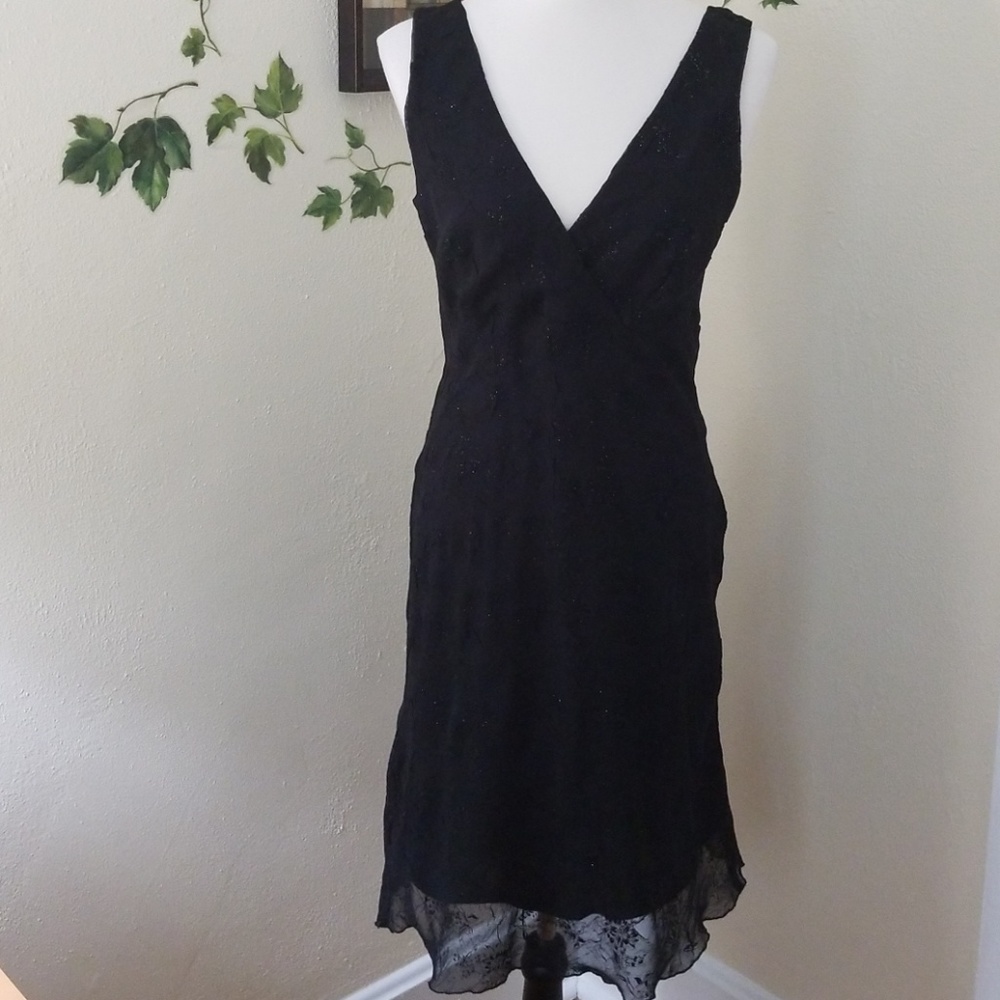 Black dress with sparkly chiffon overlay.